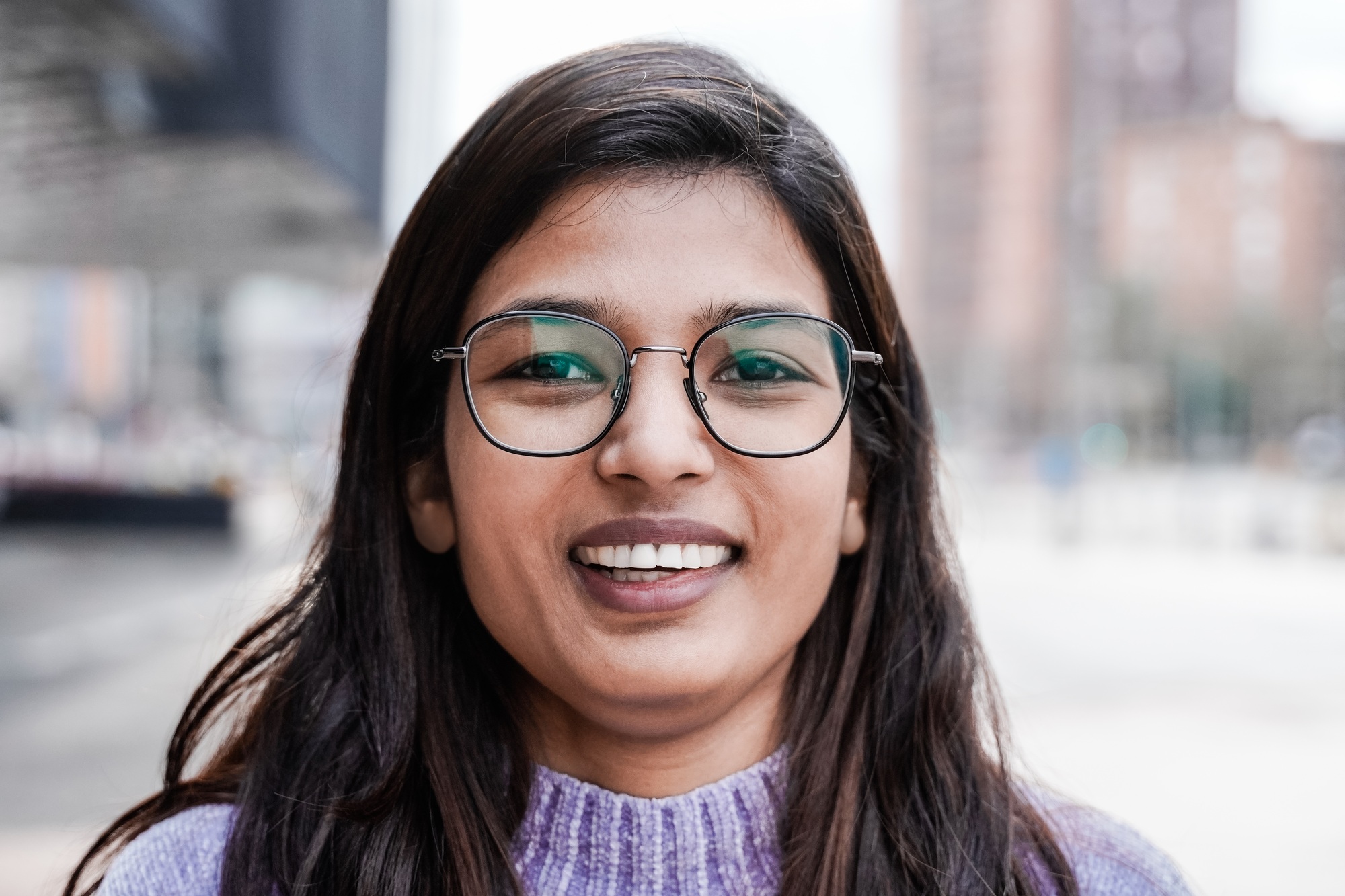 Happy Indian girl smiling on camera outdoor - Focus on face